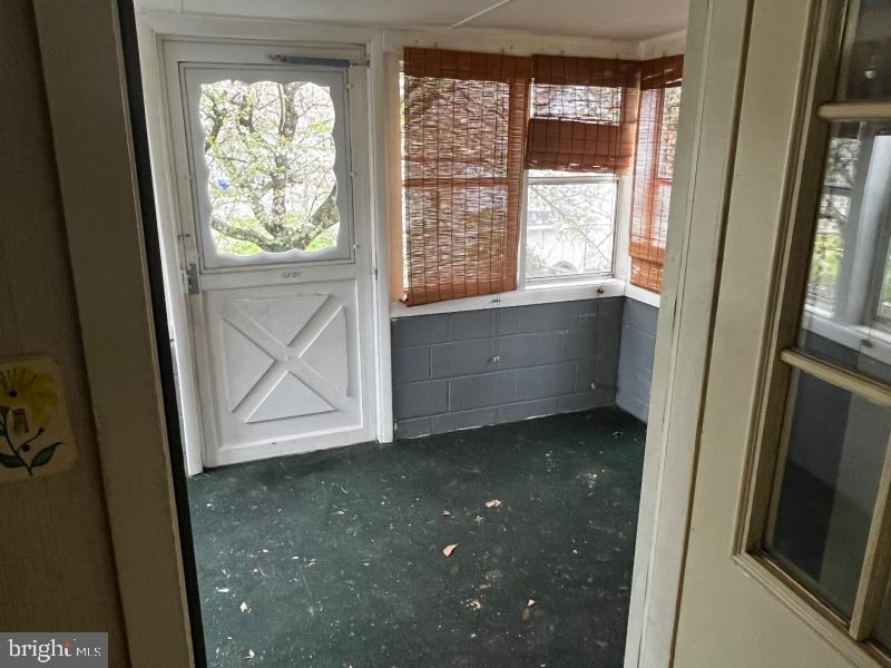 912 Nichols Drive Laurel, MD 20707 - Photo 8 of 14 a view of an empty room with wooden floor and a window