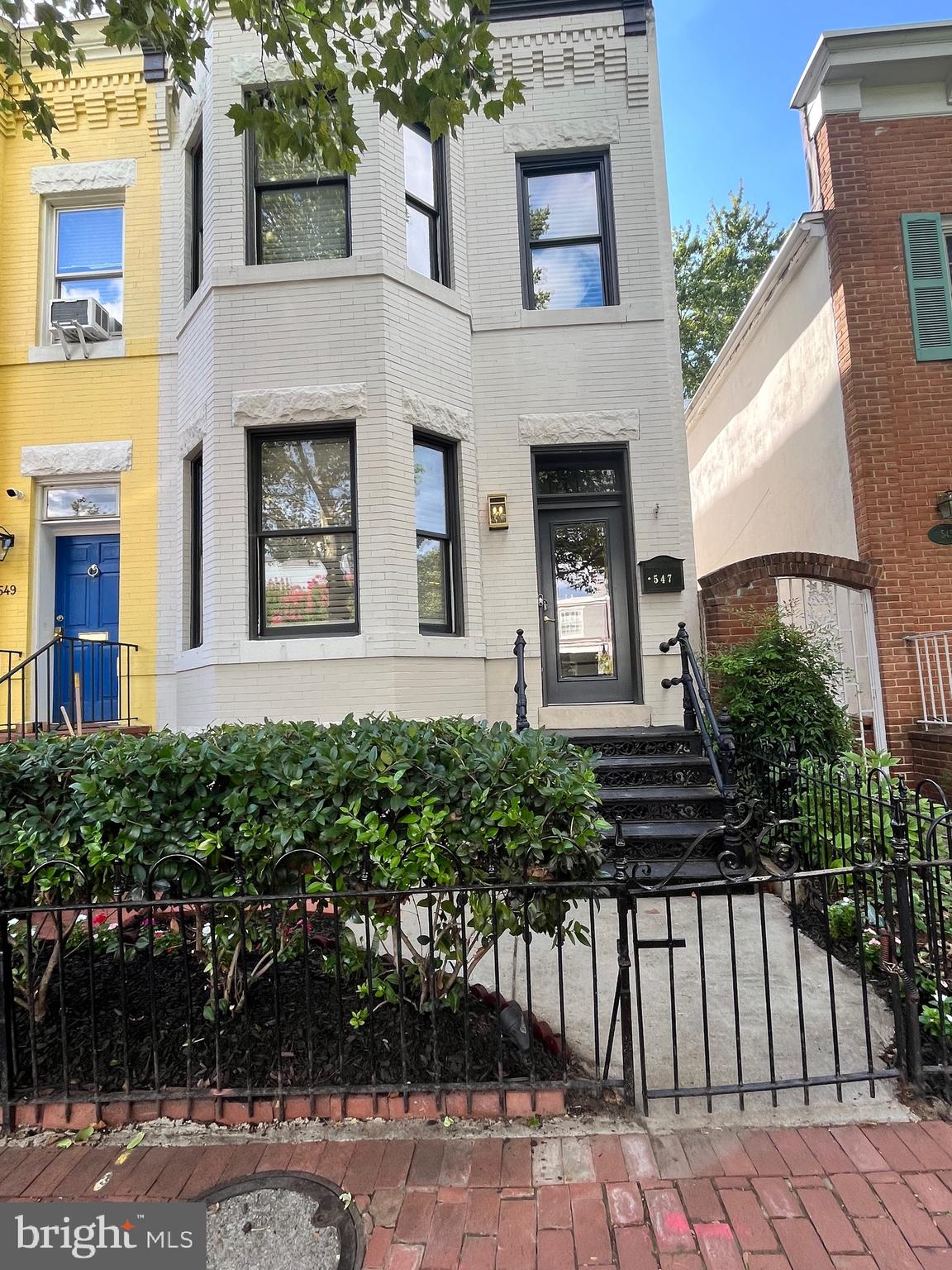 547 4th Street Southeast Washington, DC 20003 - Photo 1 of 13 a front view of a house with a garden