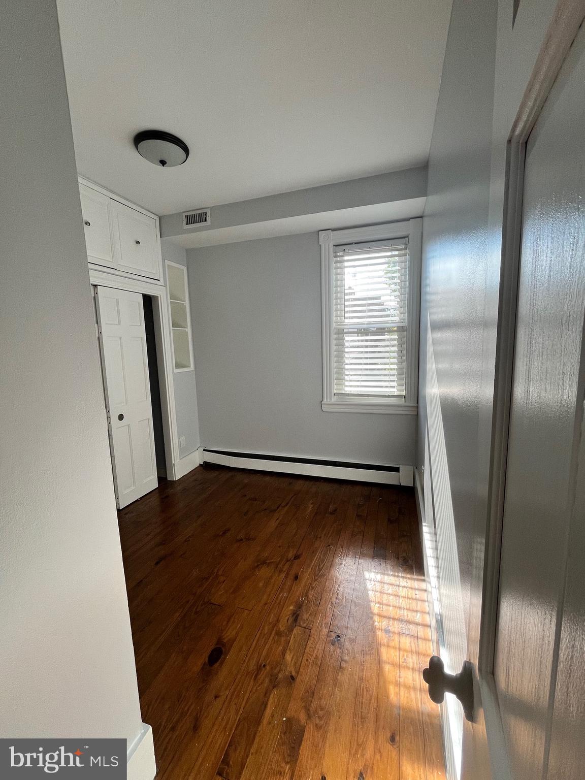 547 4th Street Southeast Washington, DC 20003 - Photo 10 of 13 a view of empty room with wooden floor and fan
