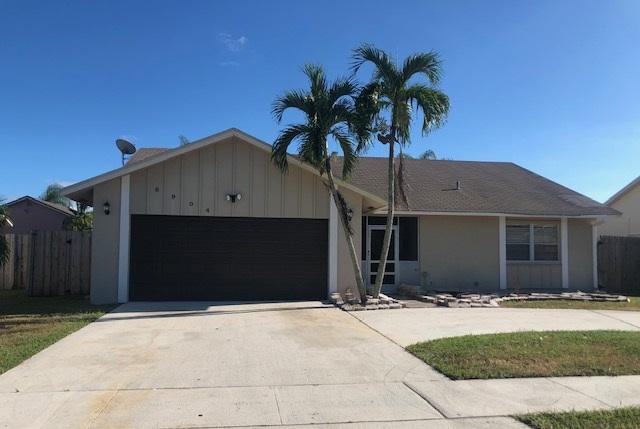 8904 Southwest 16th Street Boca Raton, FL 33433 - Photo 1 of 29 a house view with a garden space