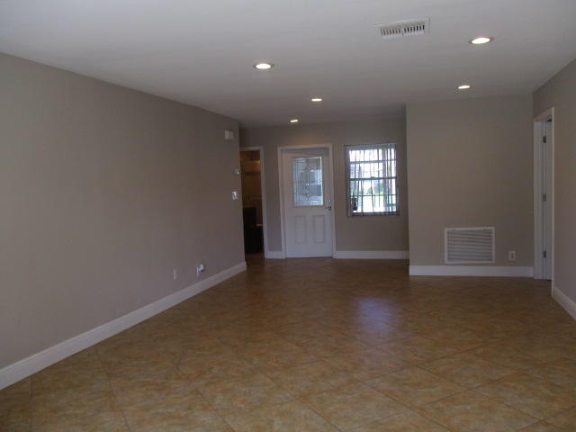 8904 Southwest 16th Street Boca Raton, FL 33433 - Photo 3 of 29 an empty room with windows and entrance
