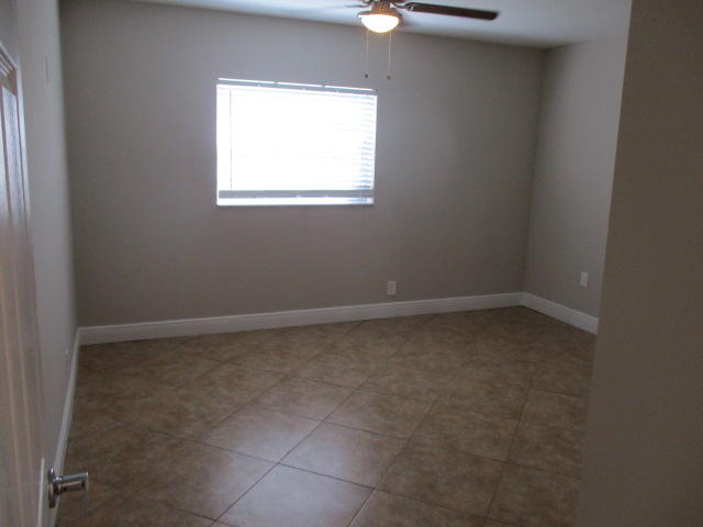 8904 Southwest 16th Street Boca Raton, FL 33433 - Photo 4 of 29 an empty room with a window