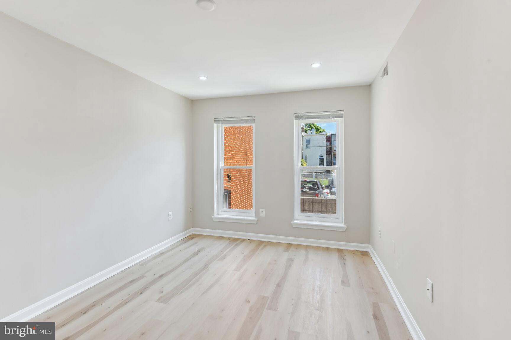 327-329 8th Street Northeast, Unit 9 Washington, DC 20002 - Photo 11 of 28 an empty room with wooden floor and window
