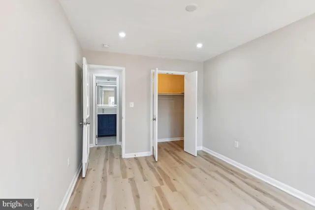 a view of hallway with wooden floor