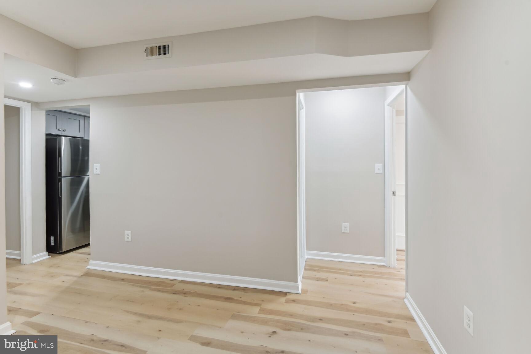 327-329 8th Street Northeast, Unit 9 Washington, DC 20002 - Photo 14 of 28 an empty room with wooden floor and closet