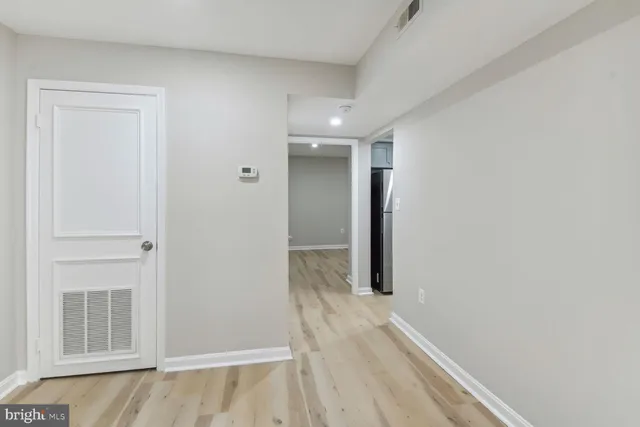 a bathroom with a sink mirror and vanity