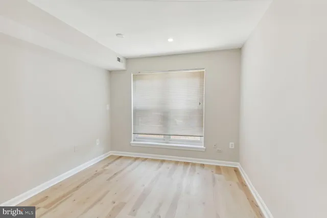 a view of hallway with wooden floor