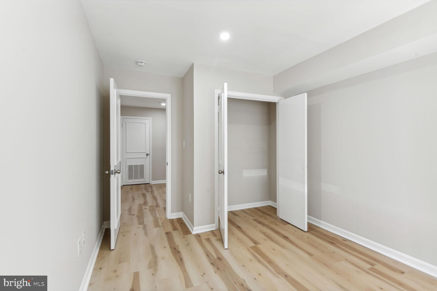 327-329 8th Street Northeast, Unit 9 Washington, DC 20002 - Photo 10 of 28 a view of a room with wooden floor and a hallway