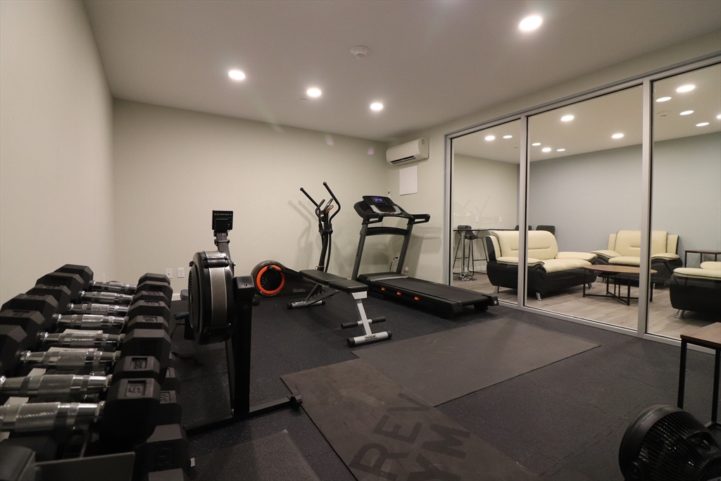 458 Washington Street, Unit 308 Boston, MA 02135 - Photo 12 of 14 a view of a room with gym equipment