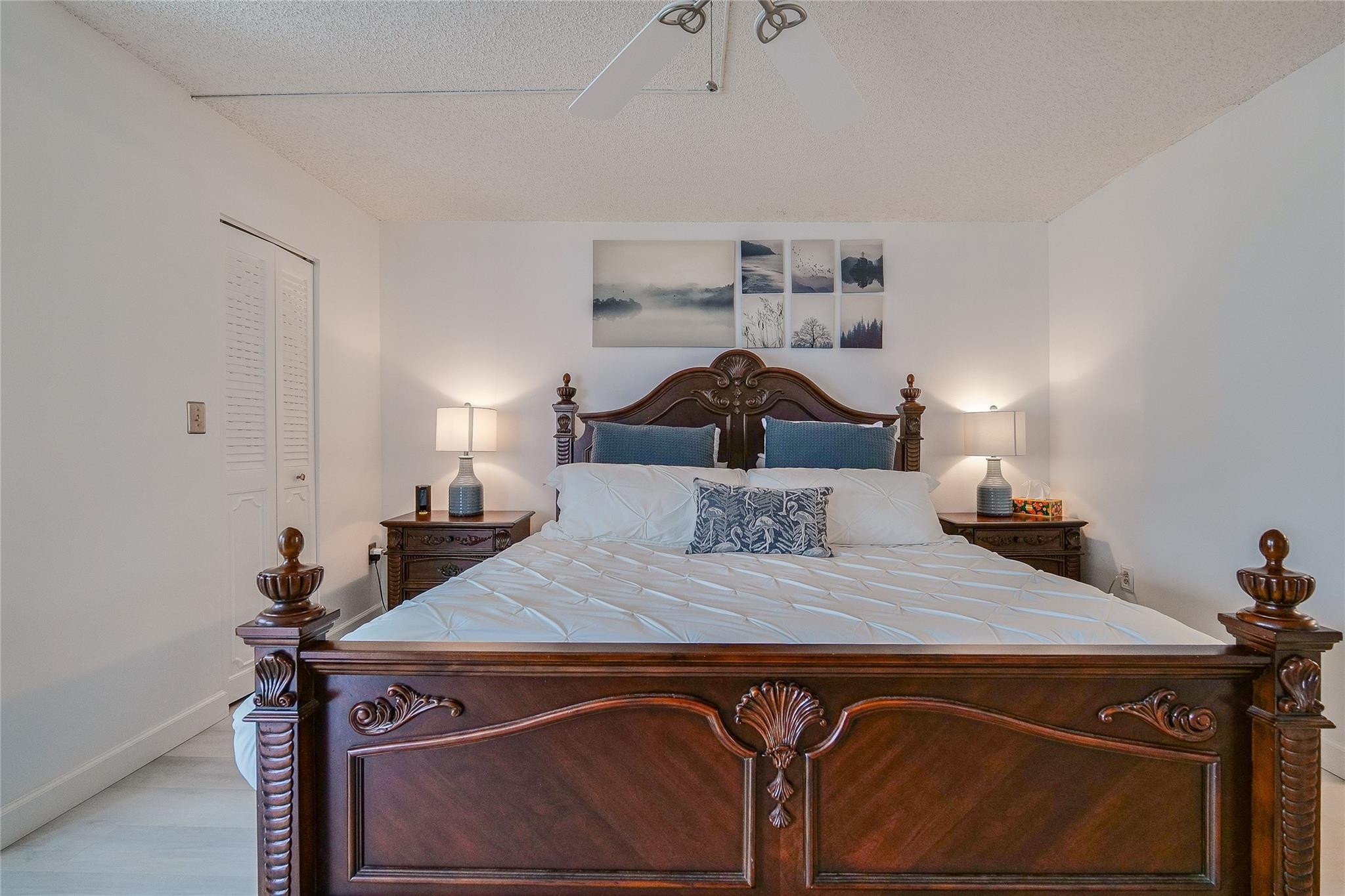 3930 Inverrary Boulevard, Unit 407D Lauderhill, FL 33319 - Photo 14 of 60 a bedroom with a bed and a dresser