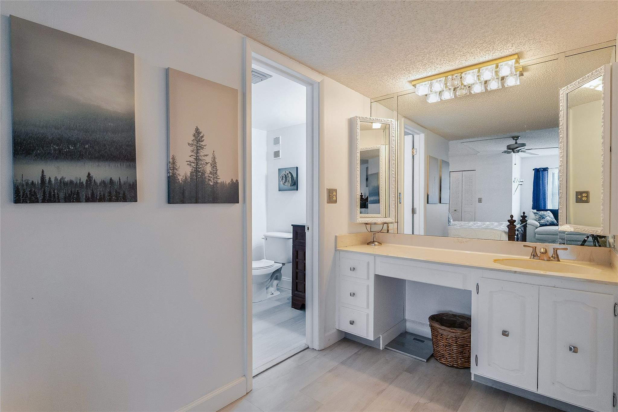3930 Inverrary Boulevard, Unit 407D Lauderhill, FL 33319 - Photo 19 of 60 a spacious bathroom with a double vanity sink toilet and shower