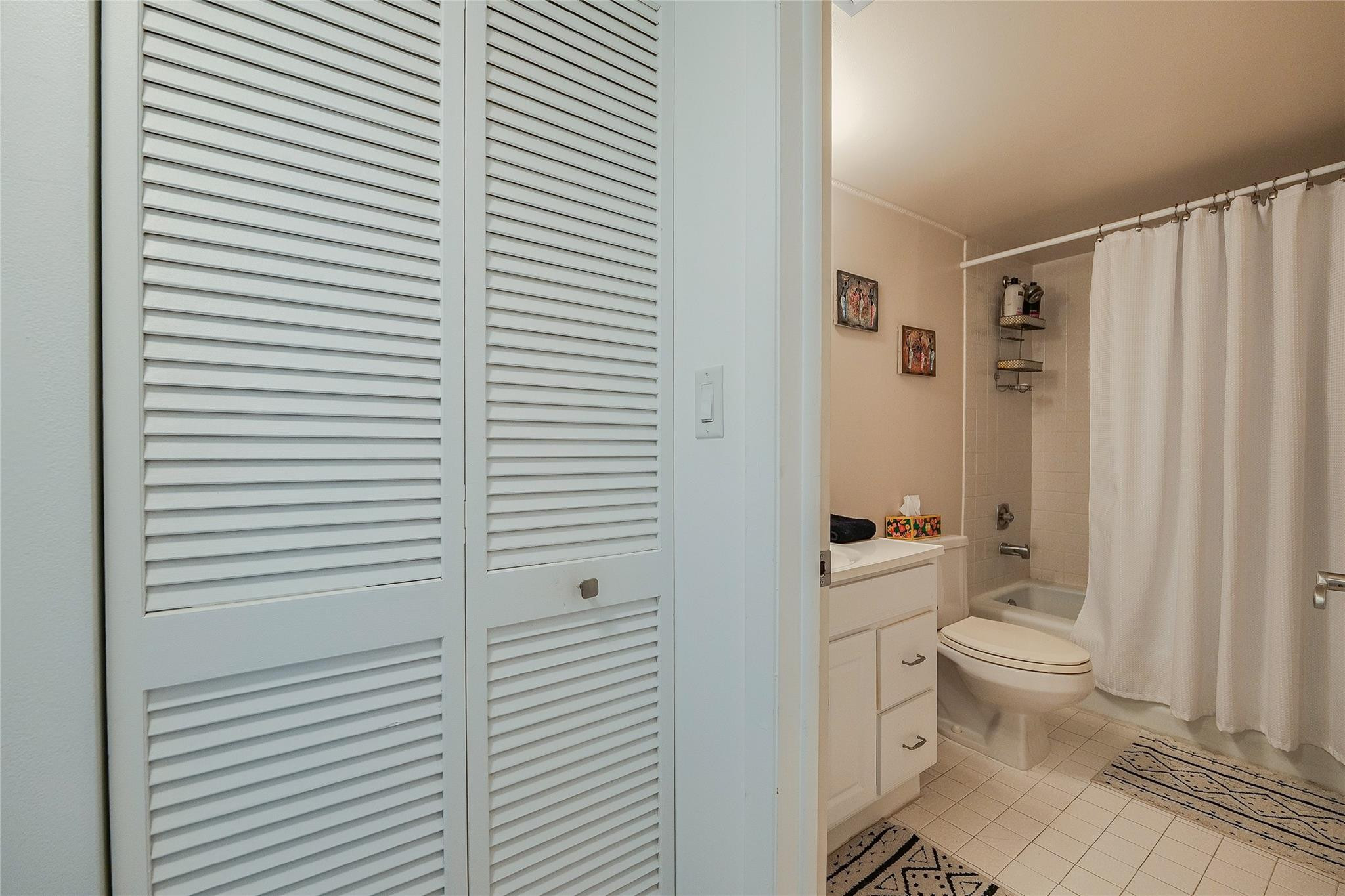 3930 Inverrary Boulevard, Unit 407D Lauderhill, FL 33319 - Photo 28 of 60 a bathroom with a toilet and a shower