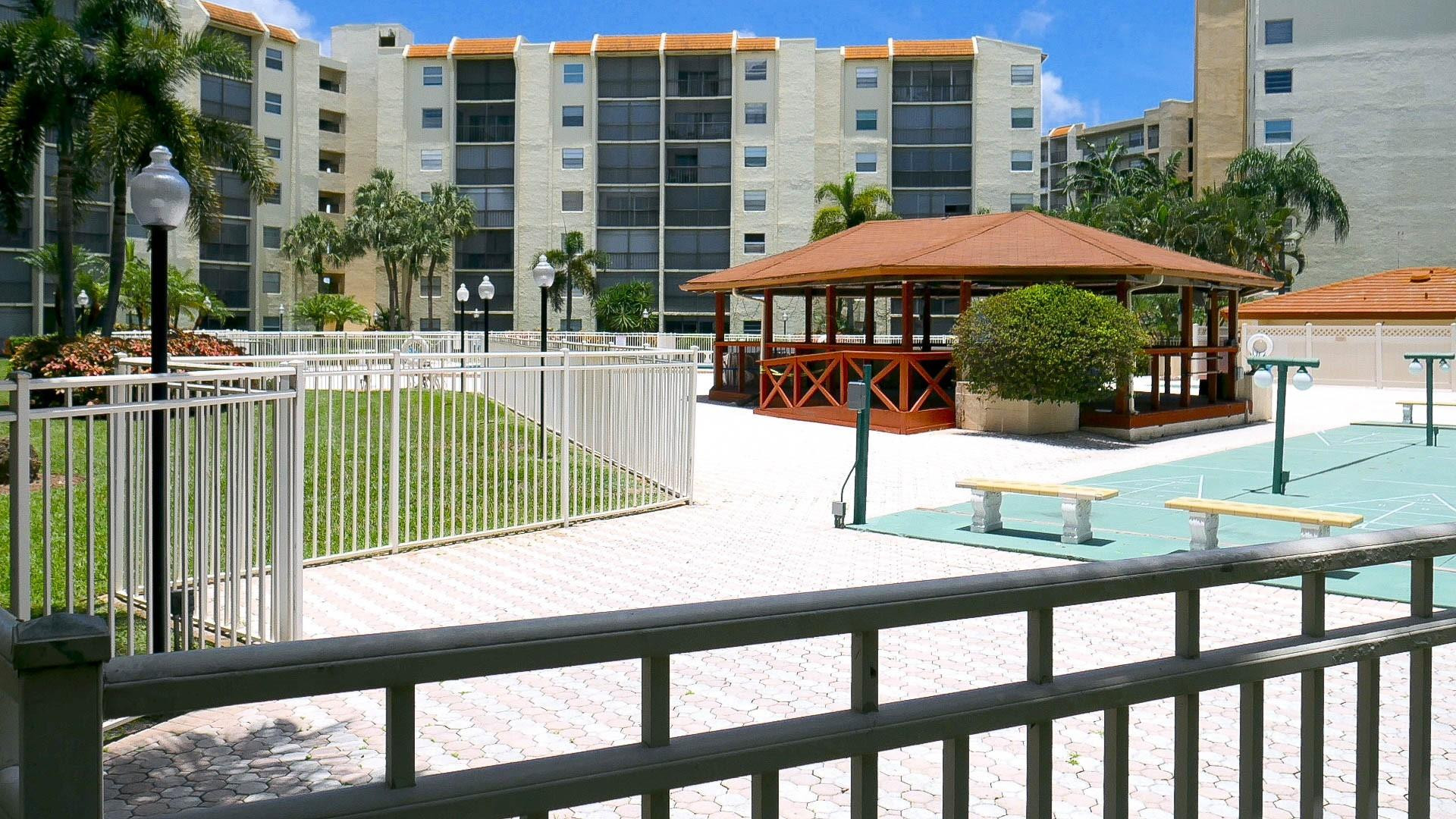 3930 Inverrary Boulevard, Unit 407D Lauderhill, FL 33319 - Photo 53 of 60 a view of a swimming pool with a lounge chairs