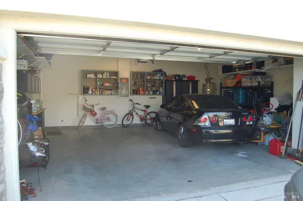 a view of parking garage with cars