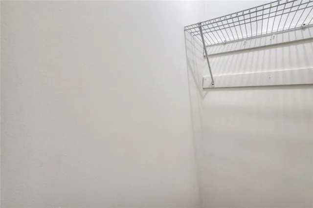 a view of staircase with white walls