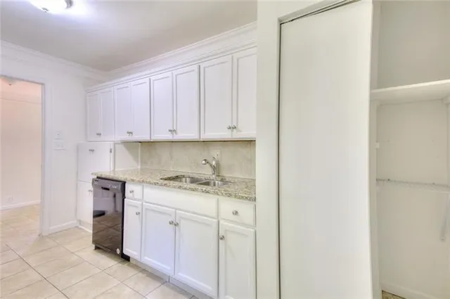 a kitchen with a stove top oven sink and cabinets