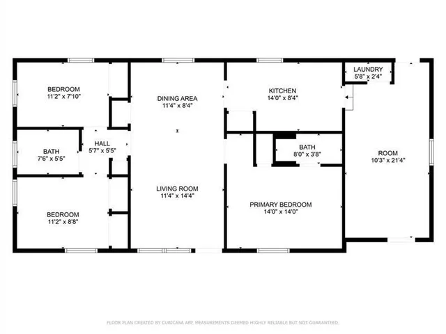 a view of a field with a tree