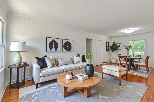 a living room with furniture and a lamp