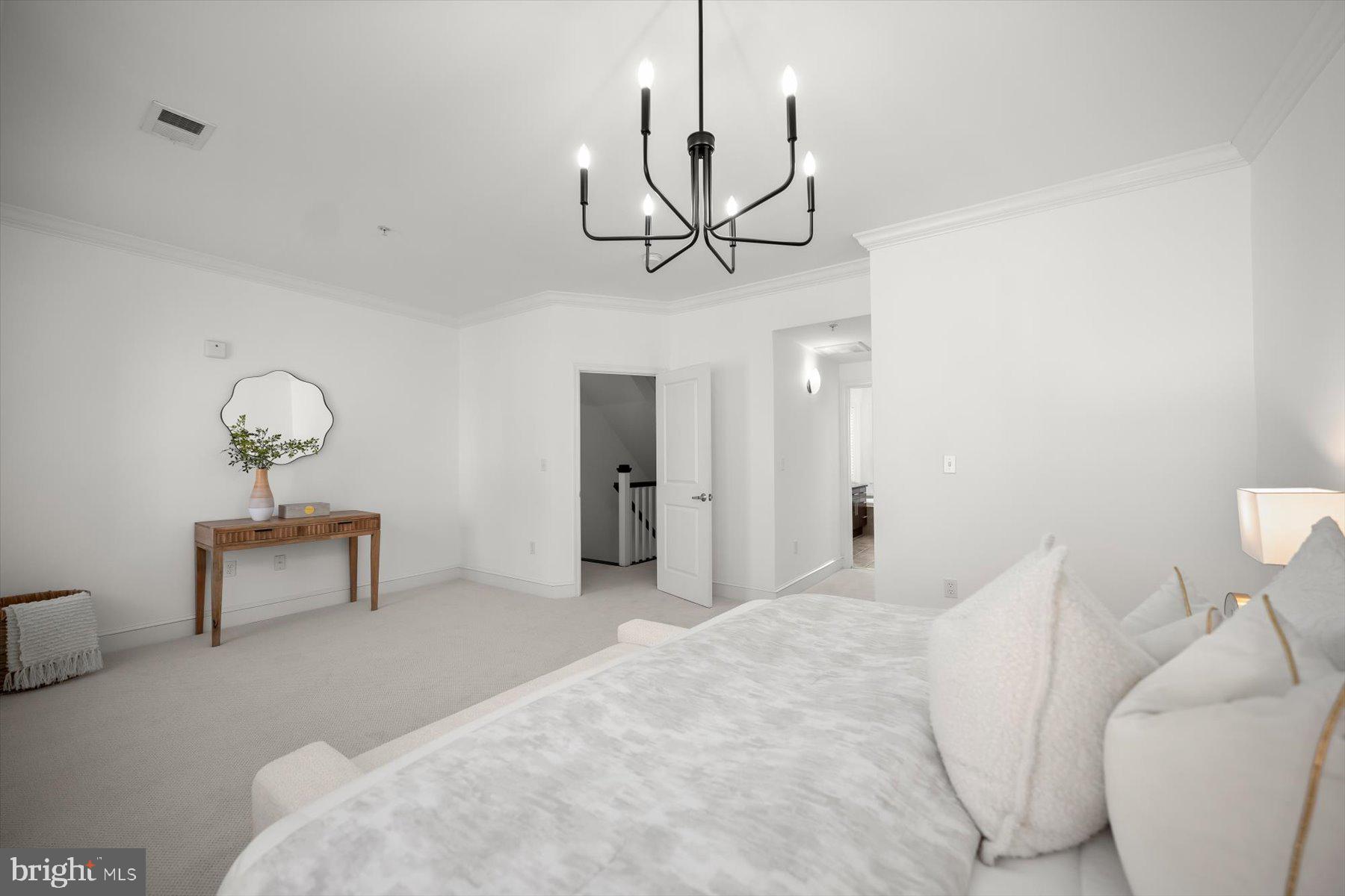 2227 12th Court North Arlington, VA 22201 - Photo 23 of 62 a bedroom with a bed and chandelier