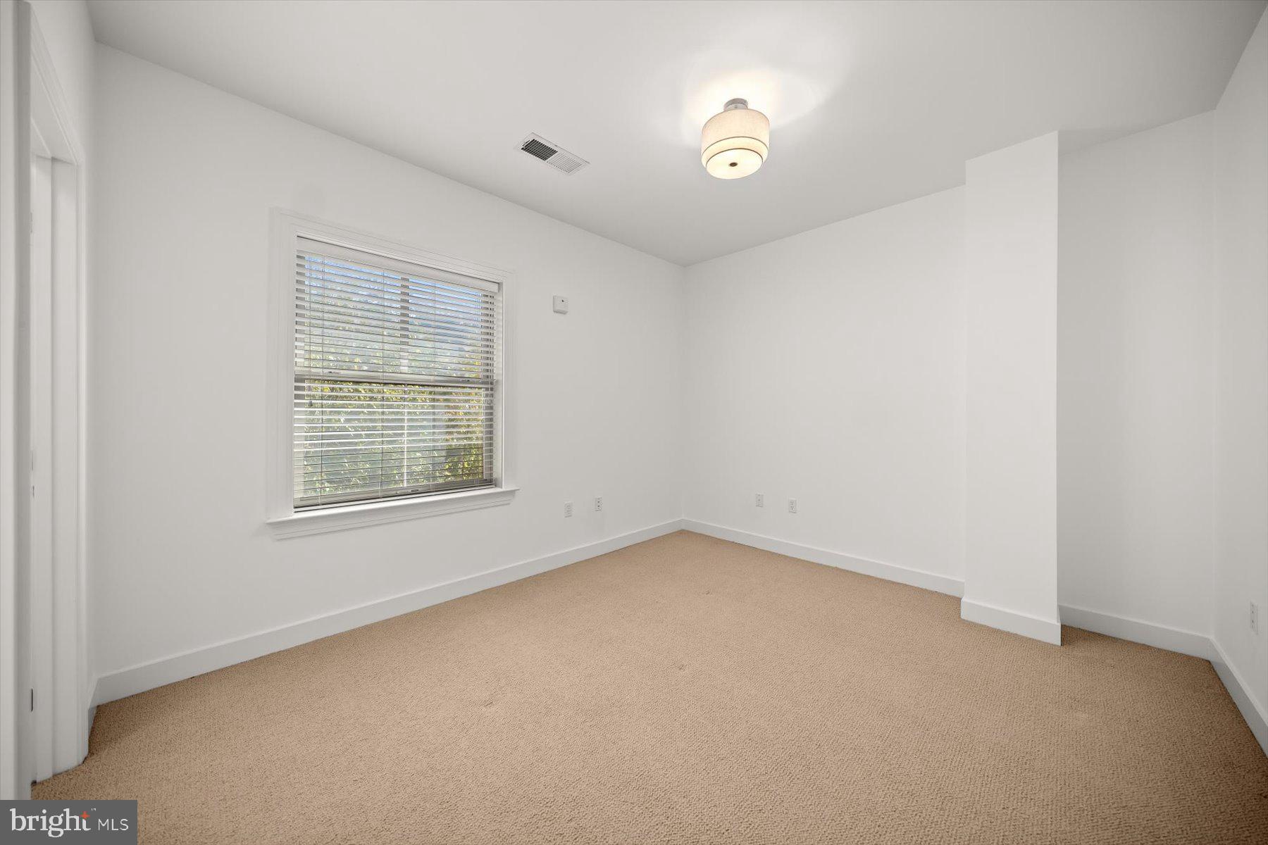 2227 12th Court North Arlington, VA 22201 - Photo 30 of 62 an empty room with a window