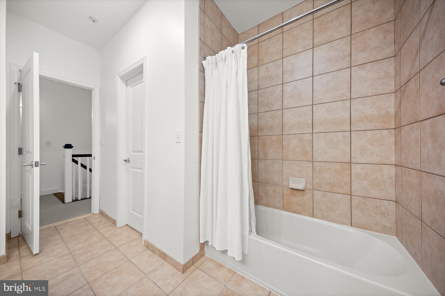 2227 12th Court North Arlington, VA 22201 - Photo 34 of 62 a bathroom with a bathtub and a shower