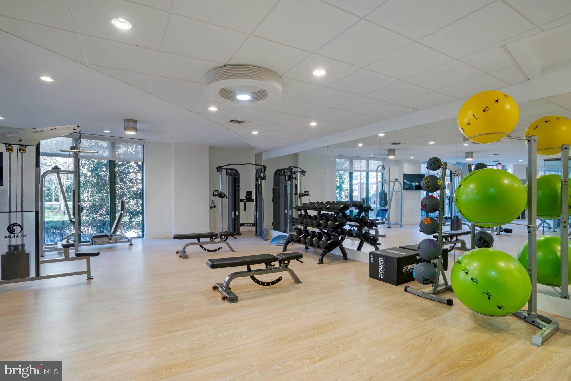 2227 12th Court North Arlington, VA 22201 - Photo 39 of 62 a view of a room with gym equipment and a large window