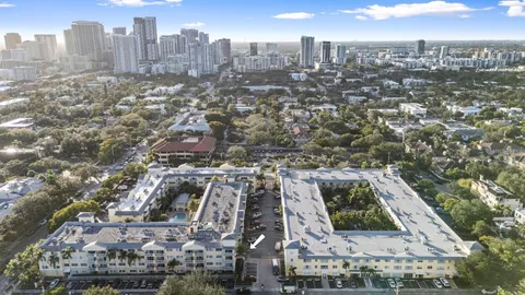 a view of outdoor space with lots of trees in the background