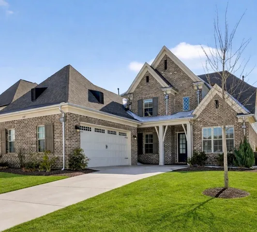 front view of a house with a yard