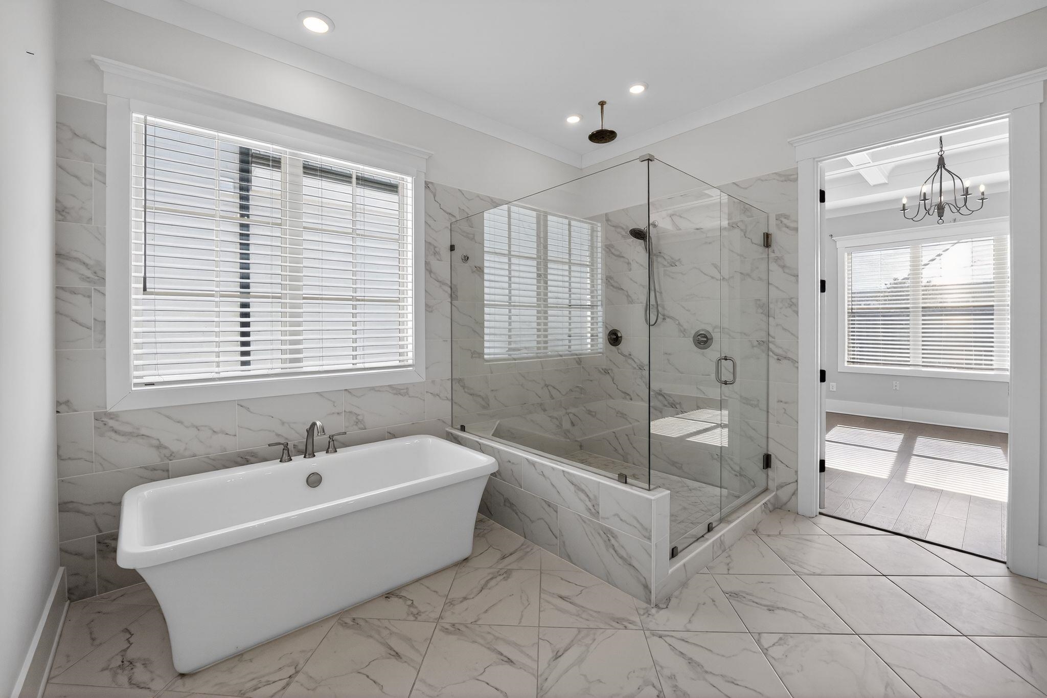 1421 Peyton Run Loop South Collierville, TN 38017 - Photo 19 of 29 Full bath with a soaking tub, a marble finish shower, light marble finish floors, ornamental molding, and recessed lighting