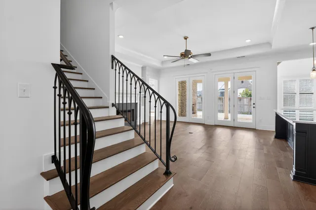 a kitchen with kitchen island granite countertop a sink a center island stainless steel appliances and cabinets