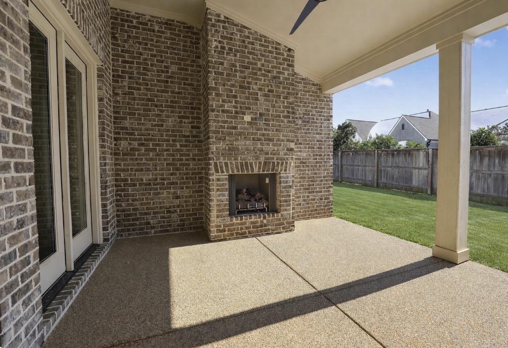 1421 Peyton Run Loop South Collierville, TN 38017 - Photo 2 of 29 View of patio with an outdoor brick fireplace and ceiling fan