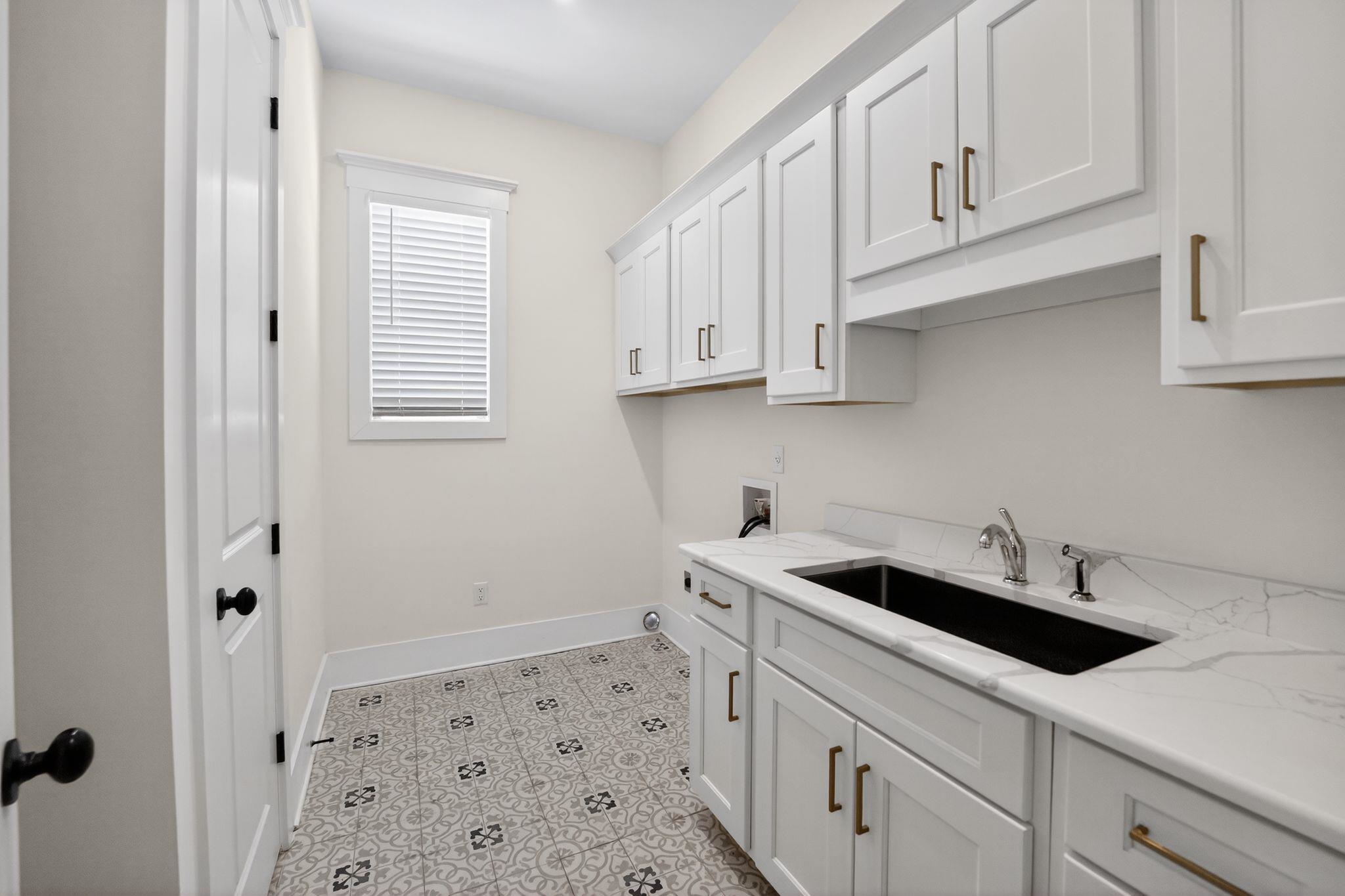 1421 Peyton Run Loop South Collierville, TN 38017 - Photo 22 of 29 Washroom with hookup for a washing machine, cabinet space, and light floors