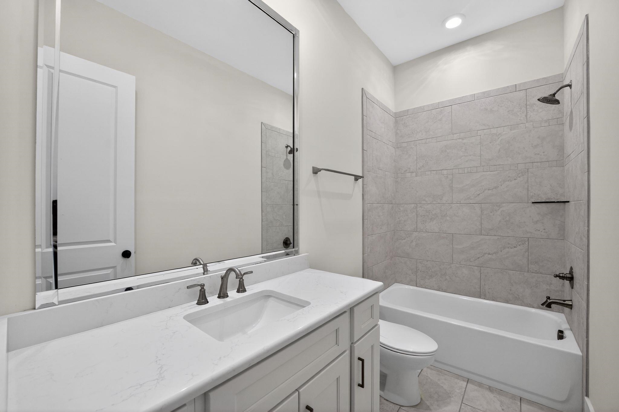 1421 Peyton Run Loop South Collierville, TN 38017 - Photo 24 of 29 Bathroom with vanity, bathtub / shower combination, and light tile patterned floors