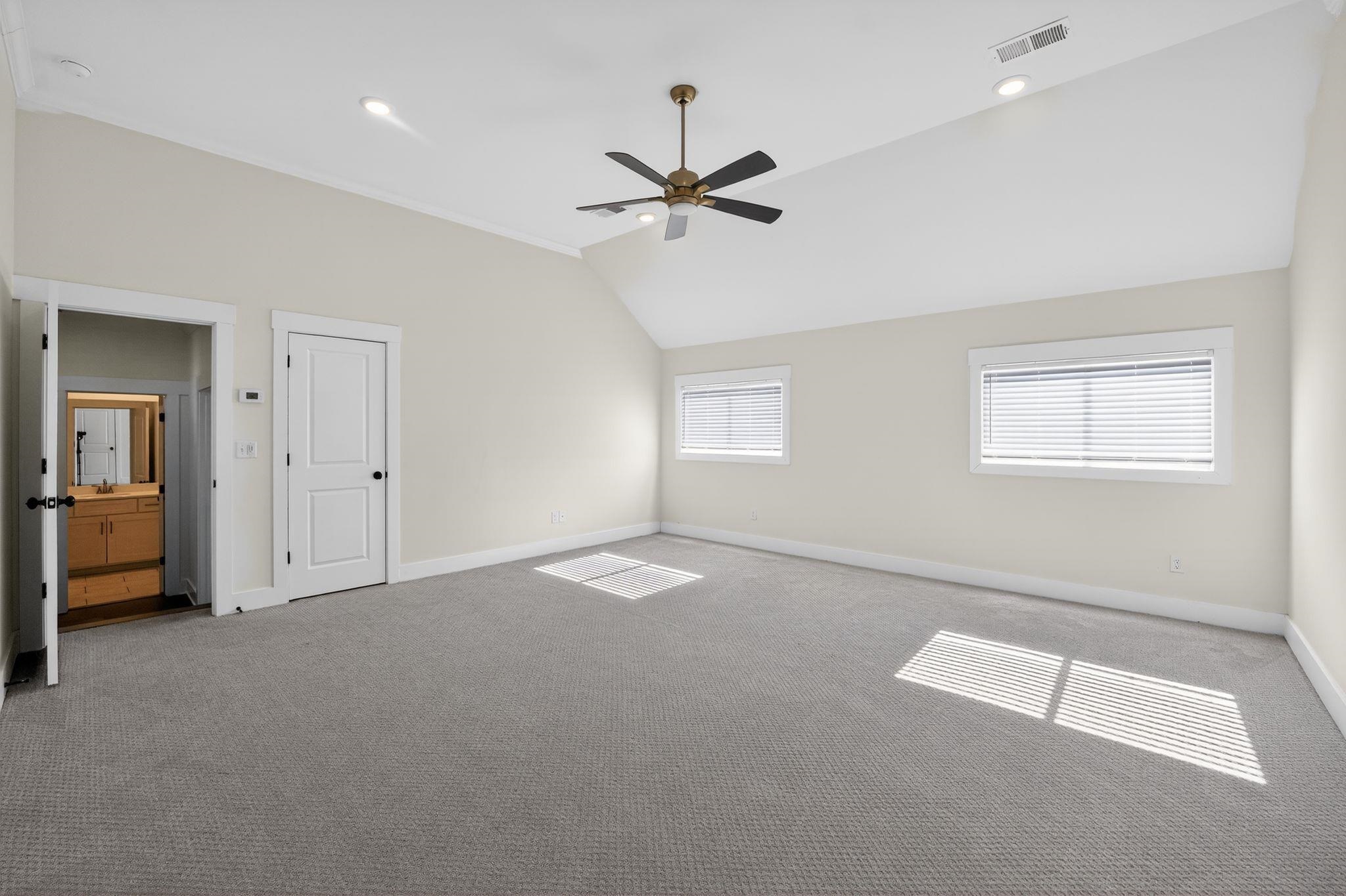 1421 Peyton Run Loop South Collierville, TN 38017 - Photo 25 of 29 Unfurnished bedroom with carpet floors, ceiling fan, vaulted ceiling, ornamental molding, and recessed lighting