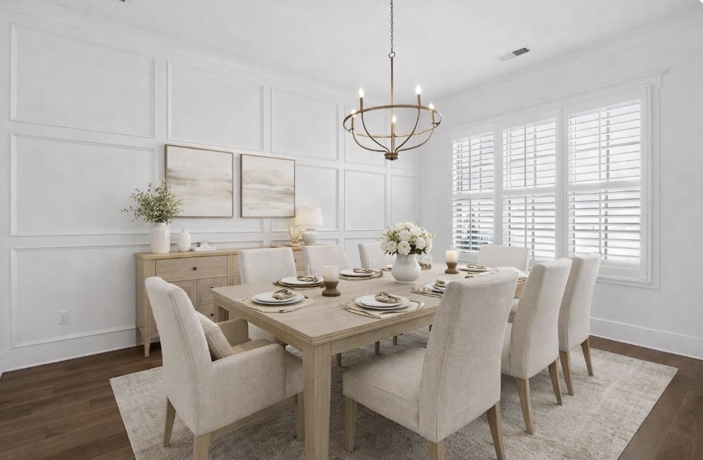 1421 Peyton Run Loop South Collierville, TN 38017 - Photo 10 of 29 Dining area with a decorative wall, dark wood-style floors, suspended lighting, and ornamental molding