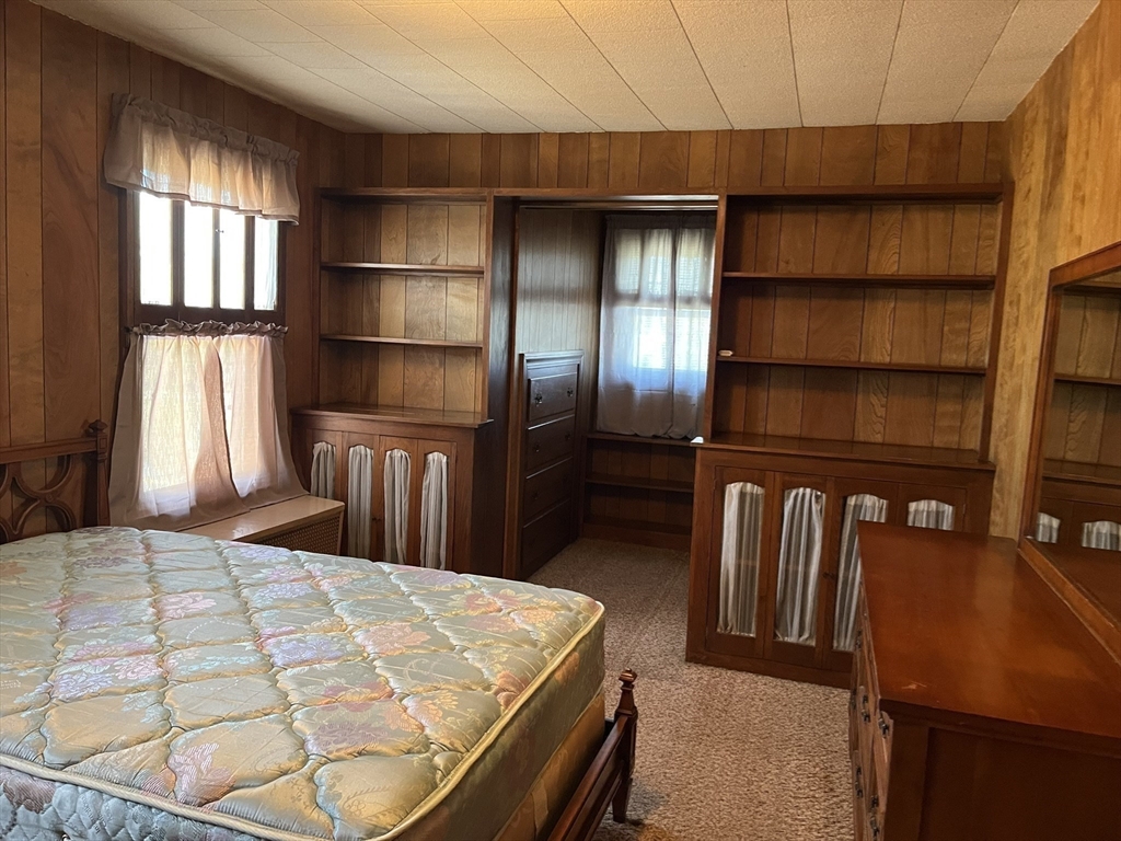 305 Harrington Way, Unit 1 Worcester, MA 01604 - Photo 16 of 21 a bedroom with a bed and a window