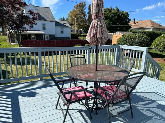 a view of a chairs and table on the deck