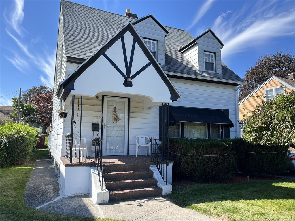 305 Harrington Way, Unit 1 Worcester, MA 01604 - Photo 21 of 21 front view of a house with a yard