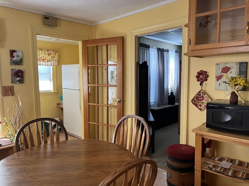 305 Harrington Way, Unit 1 Worcester, MA 01604 - Photo 5 of 21 a view of a dining room with furniture and a window