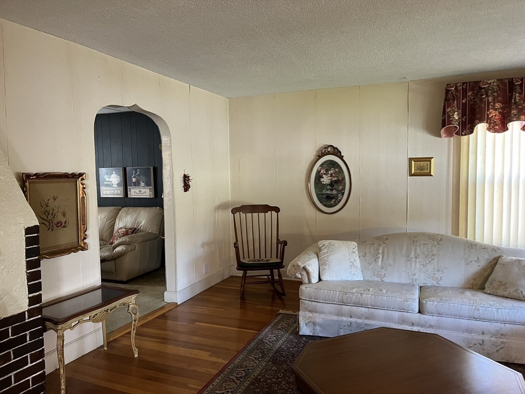 305 Harrington Way, Unit 1 Worcester, MA 01604 - Photo 7 of 21 a living room with furniture and a window