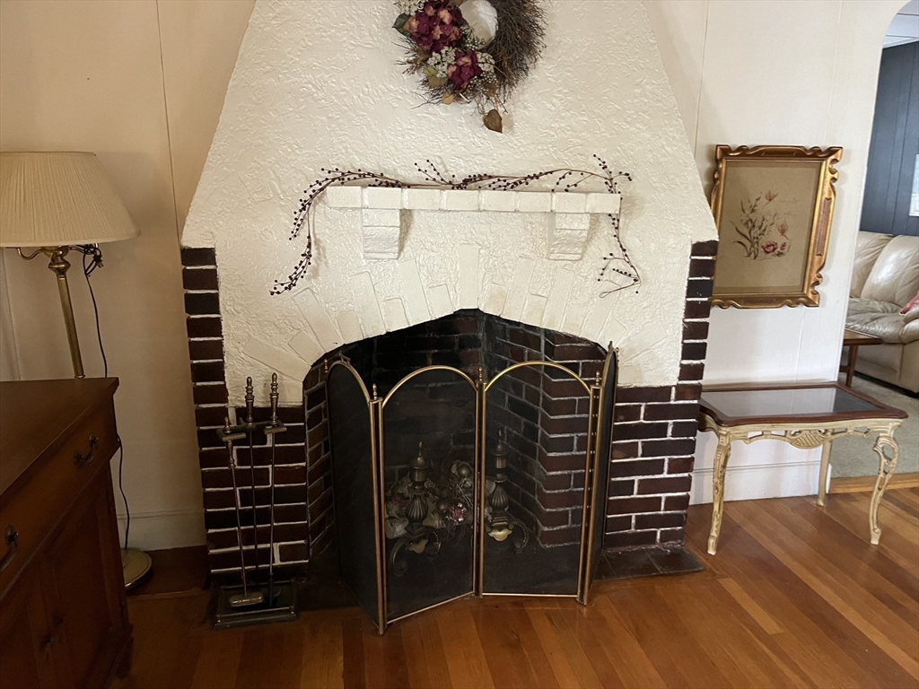305 Harrington Way, Unit 1 Worcester, MA 01604 - Photo 10 of 21 a view of a balcony with furniture and wooden floor