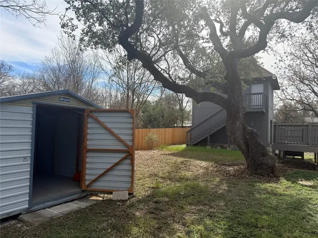 a backyard of a house with lots of green space