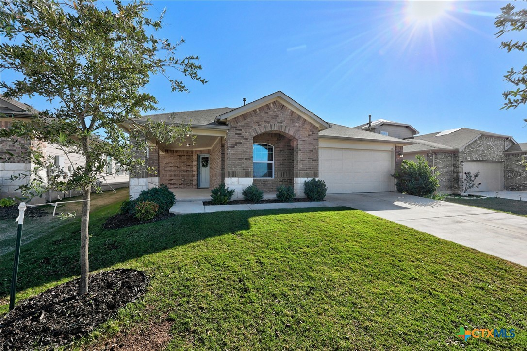 118 Rochester Lane Hutto, TX 78634 - Photo 2 of 33 a front view of a house with garden