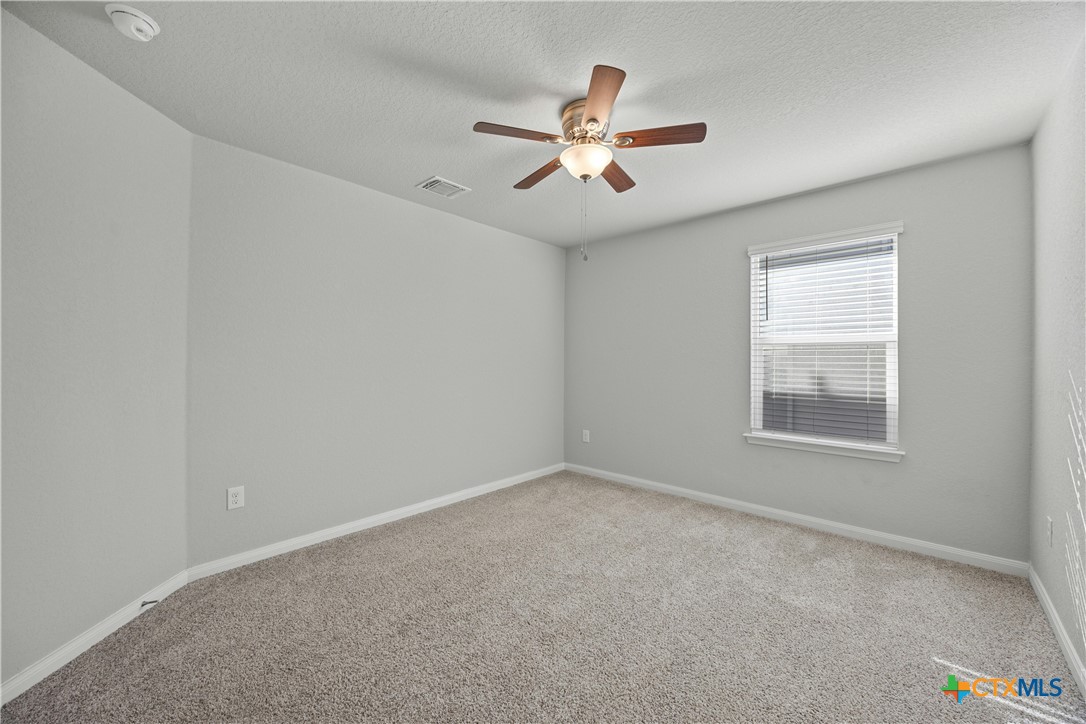 118 Rochester Lane Hutto, TX 78634 - Photo 26 of 33 a view of a livingroom with a ceiling fan and window