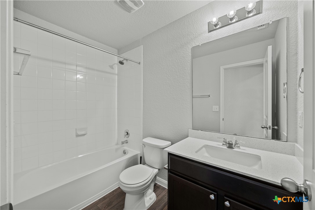 118 Rochester Lane Hutto, TX 78634 - Photo 30 of 33 a bathroom with a sink and a mirror