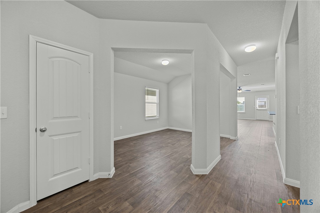 118 Rochester Lane Hutto, TX 78634 - Photo 5 of 33 wooden floor in an empty room with a window