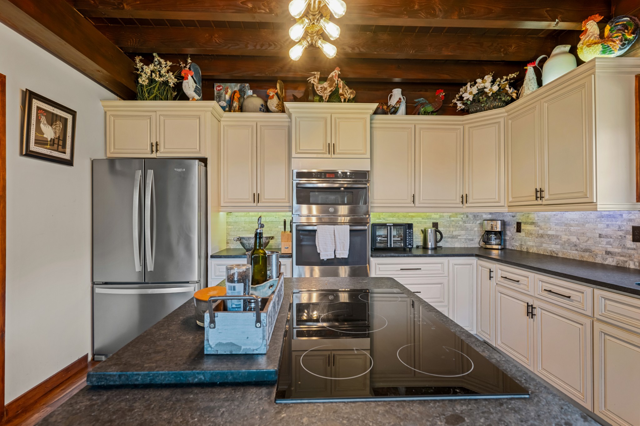 4818 Ensor Hollow Road Granville, TN 38564 - Photo 21 of 52 a kitchen with stainless steel appliances granite countertop a refrigerator a stove and a sink