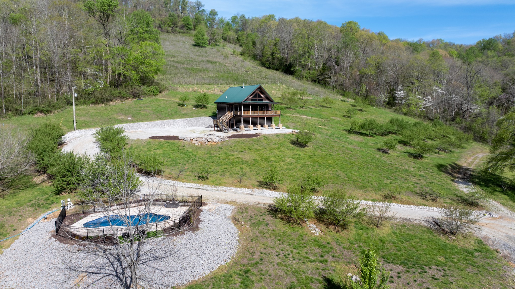 4818 Ensor Hollow Road Granville, TN 38564 - Photo 3 of 52 a backyard of a house with a yard and outdoor seating