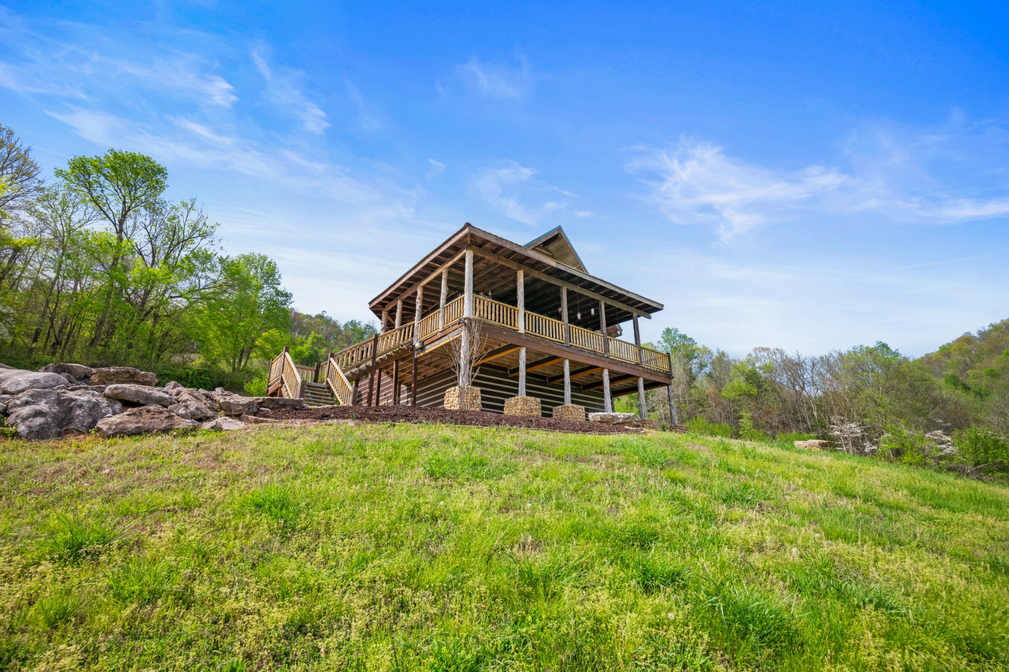 4818 Ensor Hollow Road Granville, TN 38564 - Photo 39 of 52 a view of a house with a big yard and large trees
