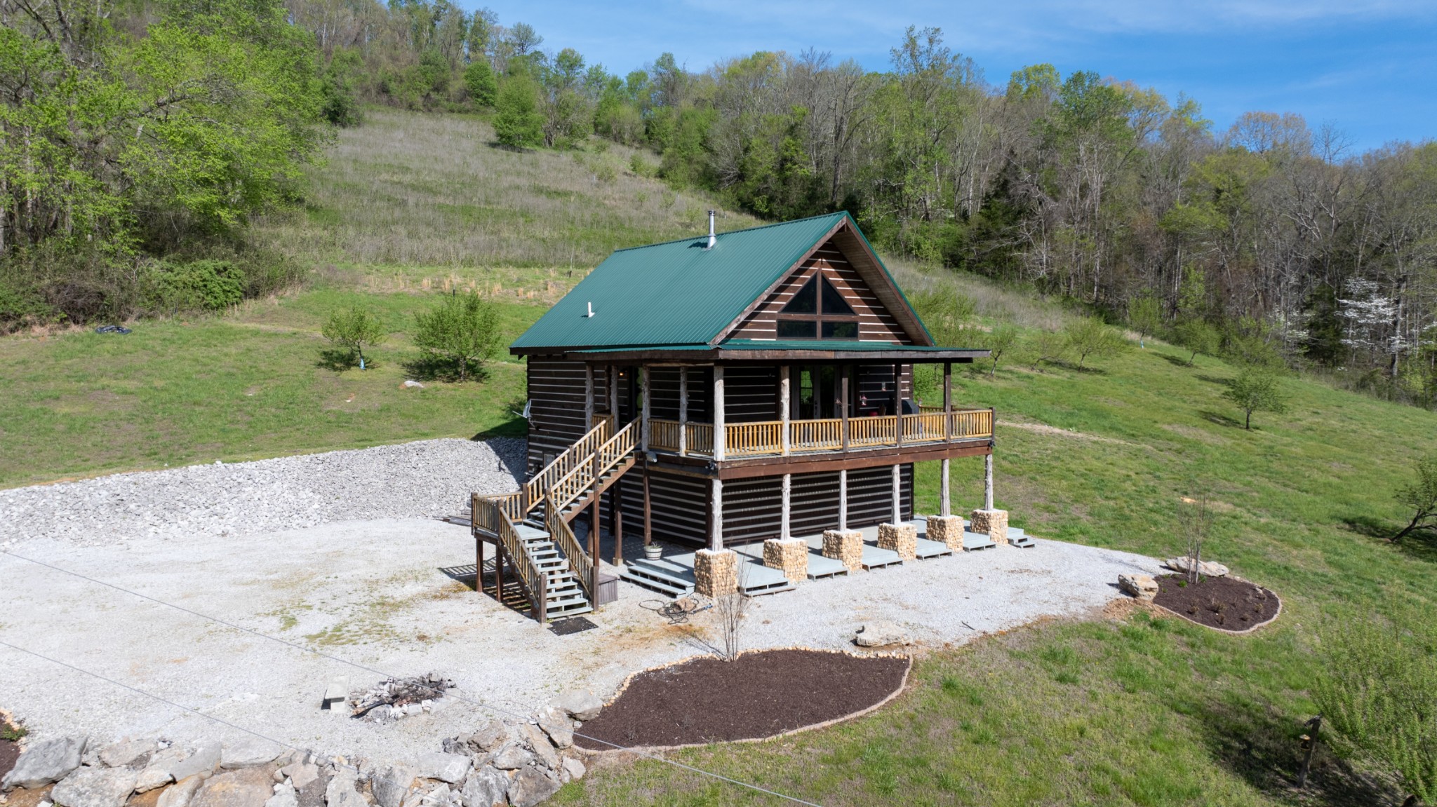 4818 Ensor Hollow Road Granville, TN 38564 - Photo 6 of 52 a front view of a house with a yard